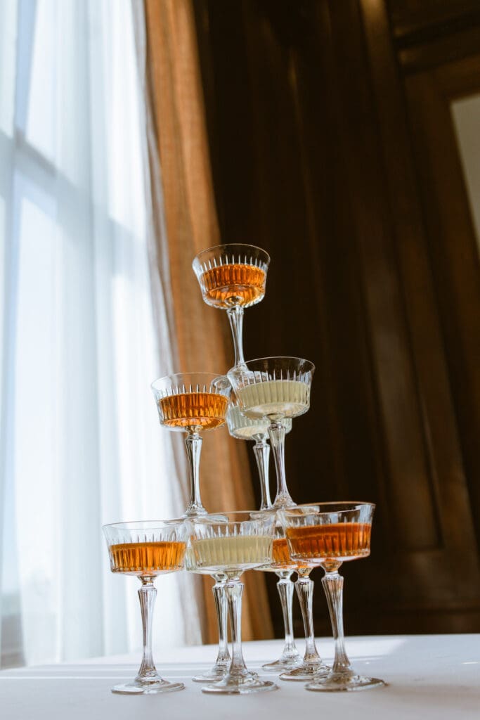 Champagne tower in Let Them Eat Cake Marie Antoinette luxury wedding editorial by Gabrielle Pellegrino Photography