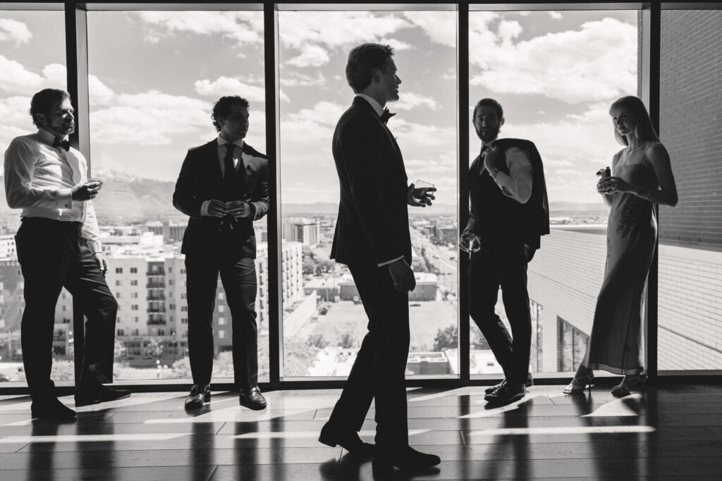 Black and white silhouette of wedding party at Van Ryder rooftop bar, Le Méridien Salt Lake City