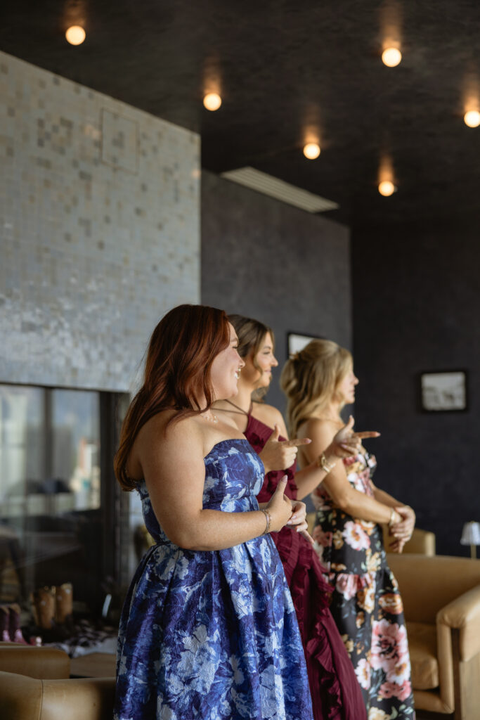 Bridesmaids in floral dresses laughing during getting ready, Le Méridien SLC