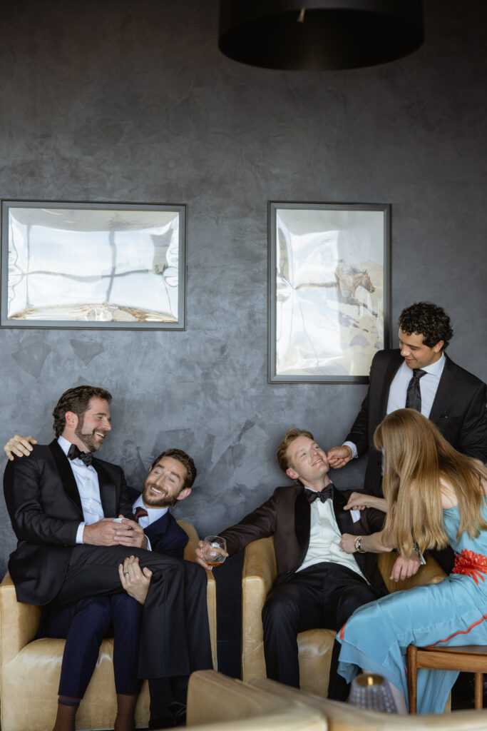 Playful editorial Groomsmen Photos outside Van Ryder Le Meridian Downtown