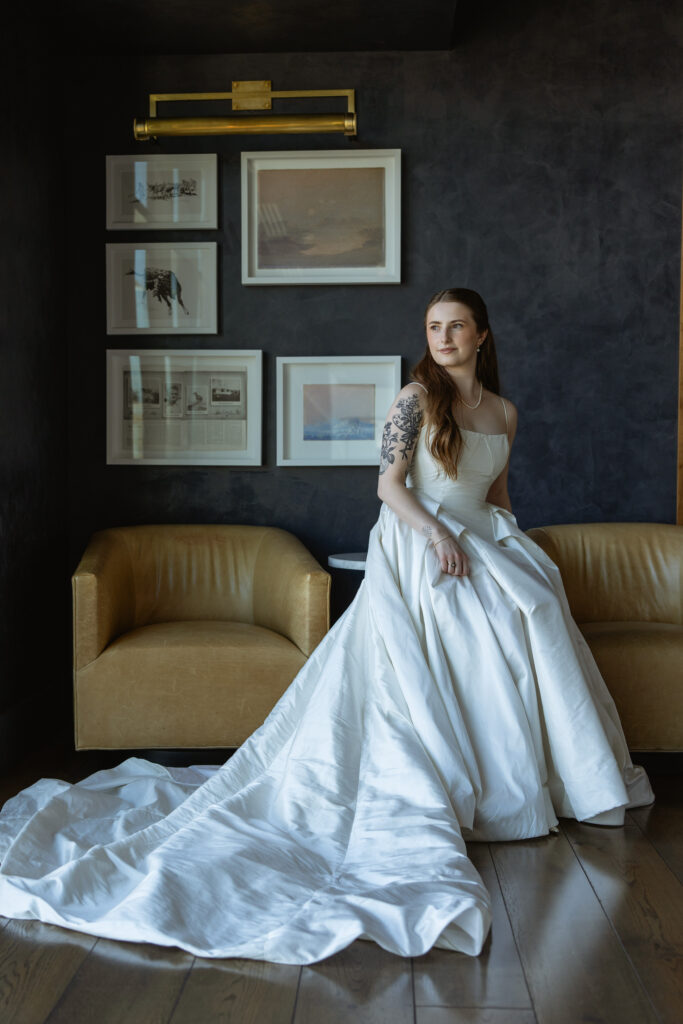 Editorial Bride portrait against gallery wall in Van Ryder, Le Méridien getting ready photos