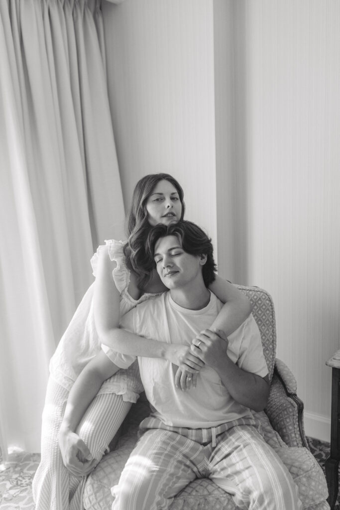 Black and white portrait of couple embracing in armchair, Salt Lake City anniversary session