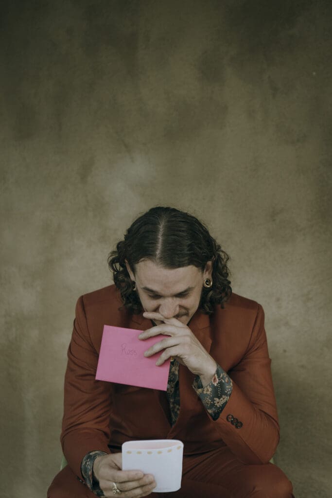 groom wipes away tears moments before getting married in a letter written by his soon to be wife