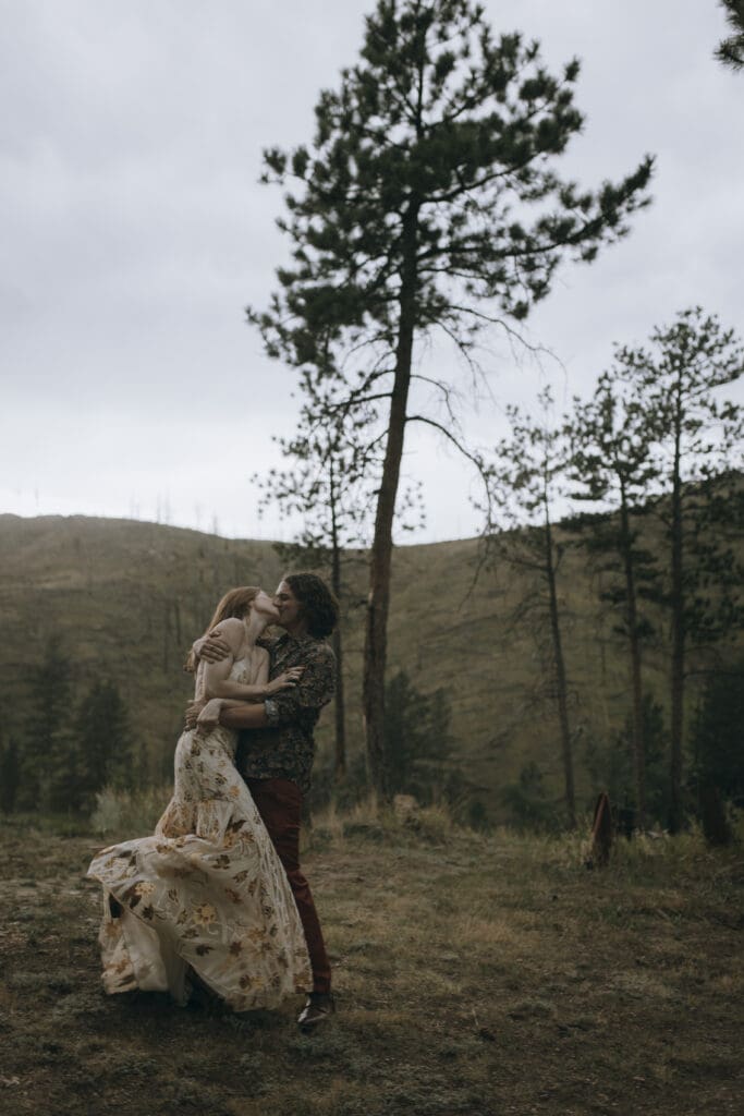 couple shares a romantic  kiss during the reception