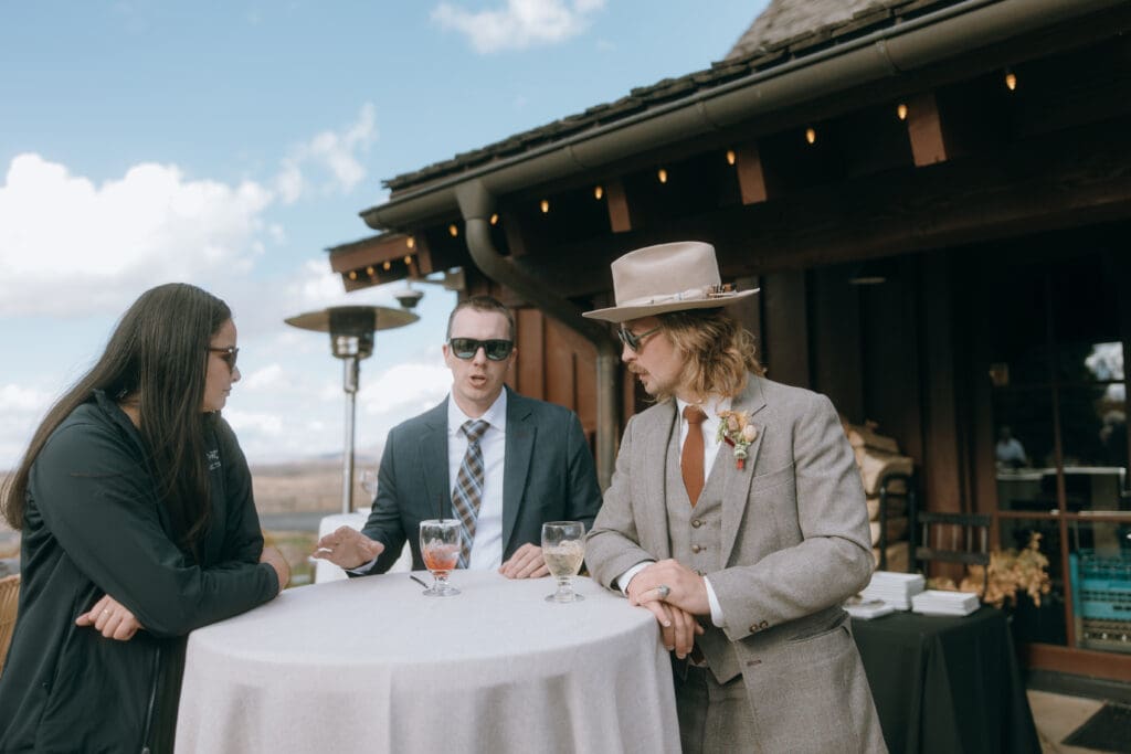 outdoor Cocktail hour among guests talking Utah 